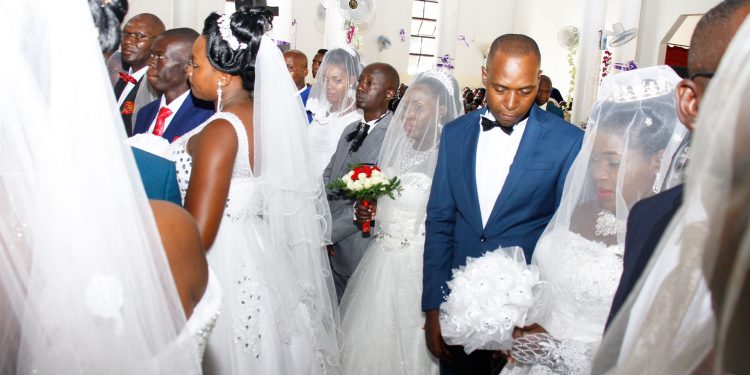 Pictorial: All Saints Cathedral weds 16 in corporate wedding