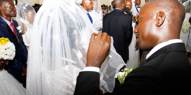 Pictorial: All Saints Cathedral weds 16 in corporate wedding