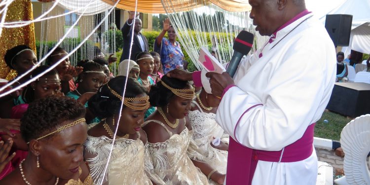 Merry-making as Mbarara man marries off twins at once